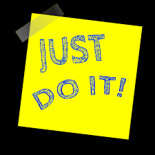 A Post-It™ note that has "Just Do It!" handwritten on it.