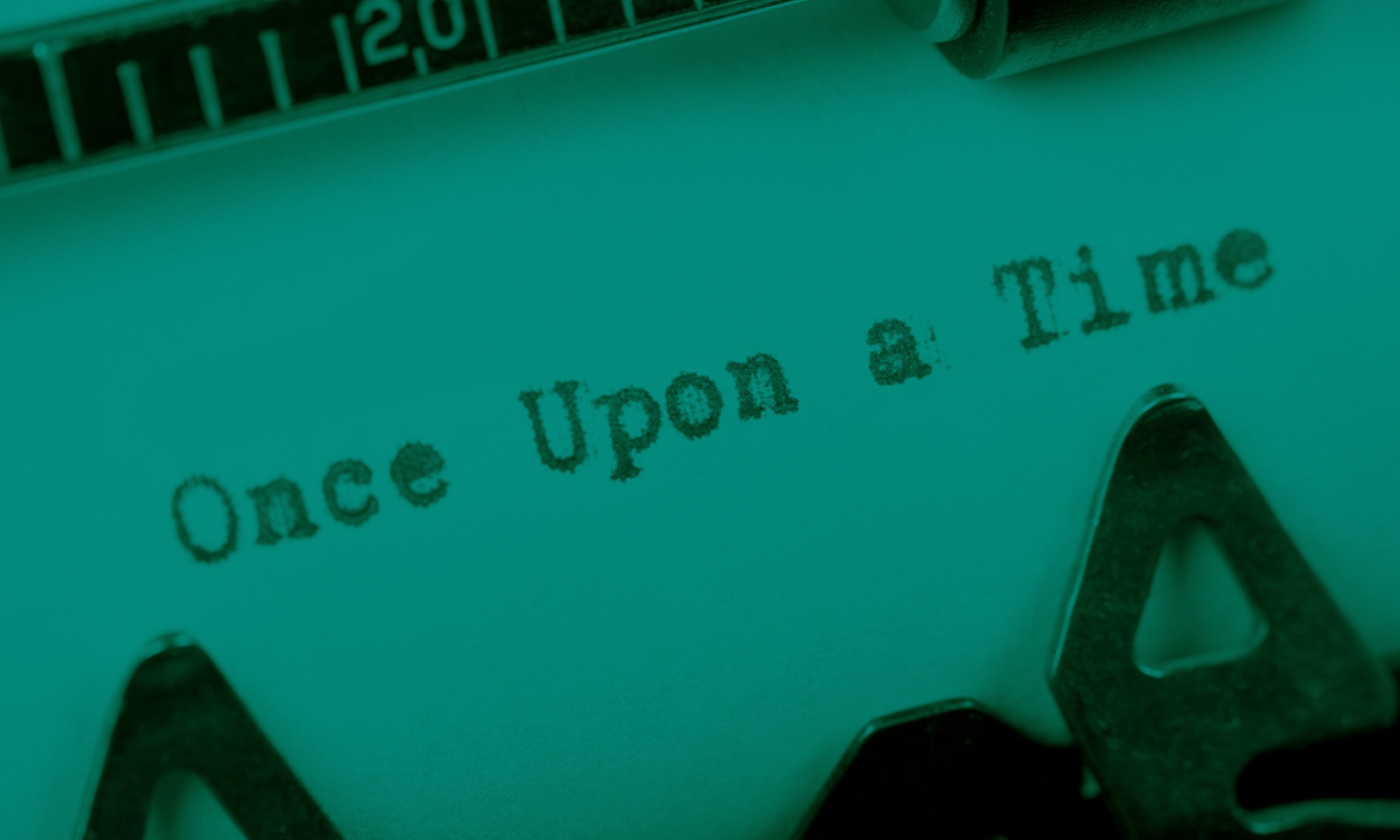 A piece of paper in a typewriter with the words, "Once Upon a Time."