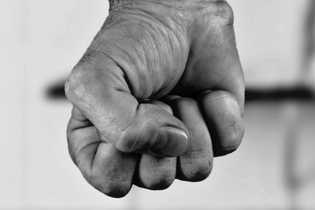 A close-up image of a fist in black and white.