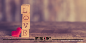 Wooden blocks stacked on top of each other, spelling the word: love.